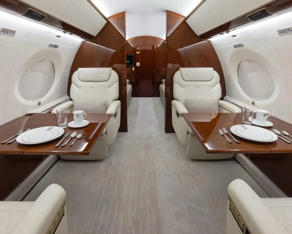 Gulfstream G650ER conference and dining area with executive seating and table