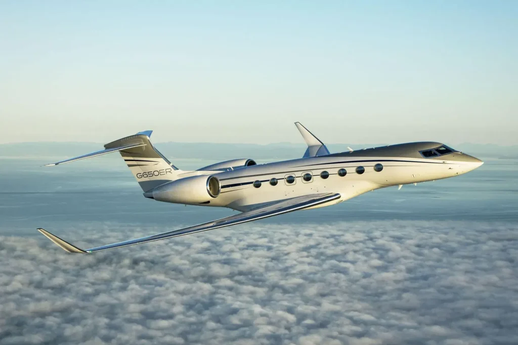 Gulfstream G650ER ultra-long-range business jet flying above the clouds